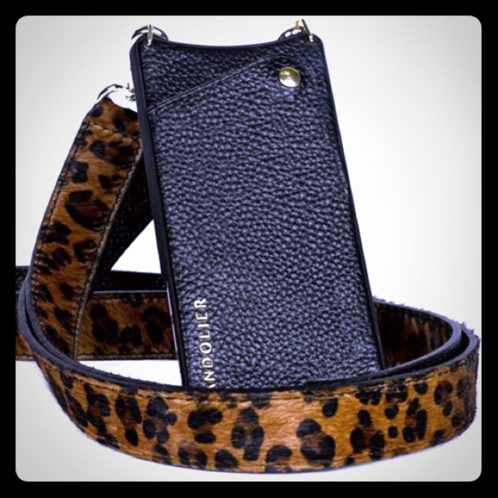 BANDOLIER leopard on black leather strap w/gold.